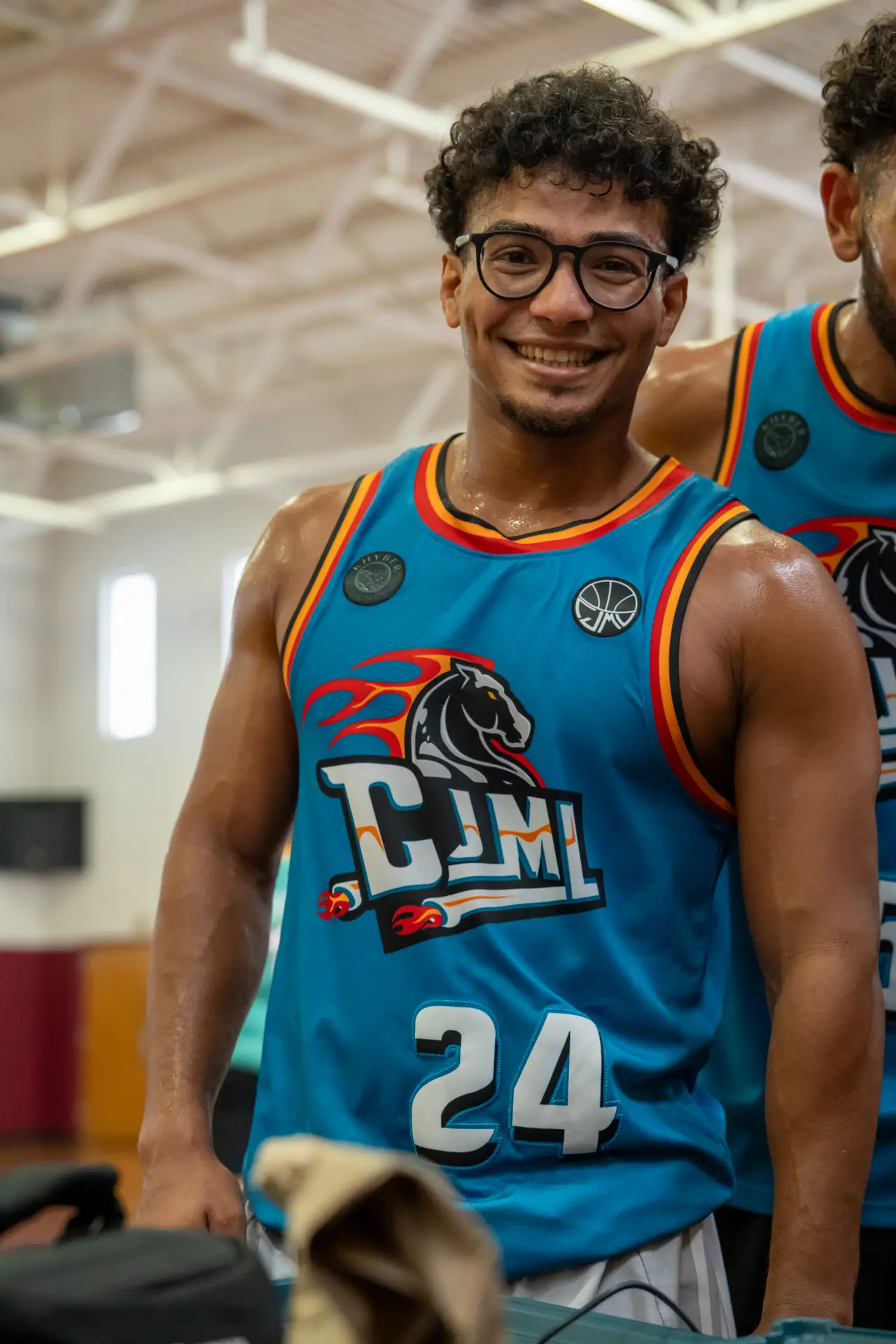 A player wearing a custom DMV-style sublimated basketball jersey