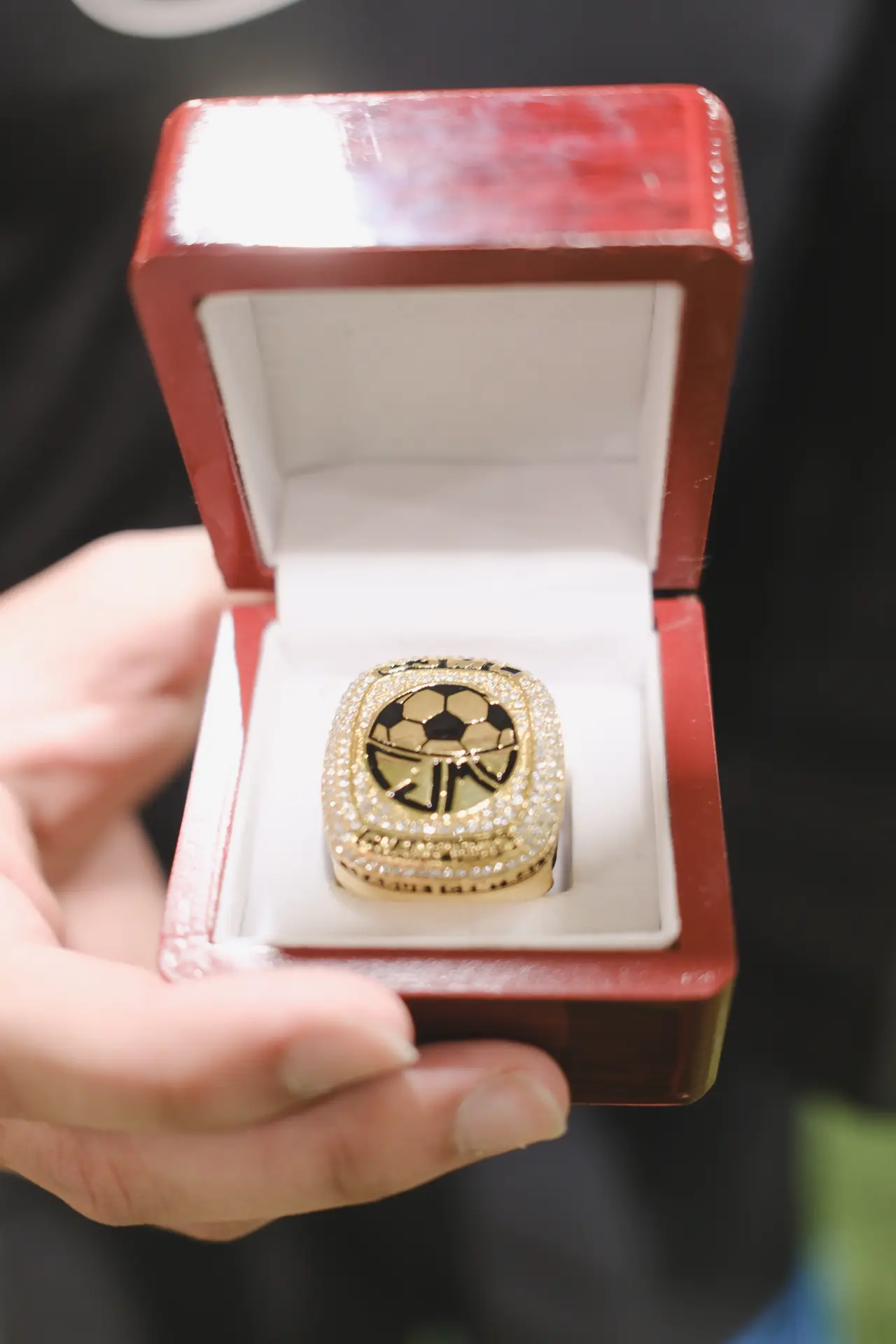 A gold DMV Muslim League championship ring in its presentation box
